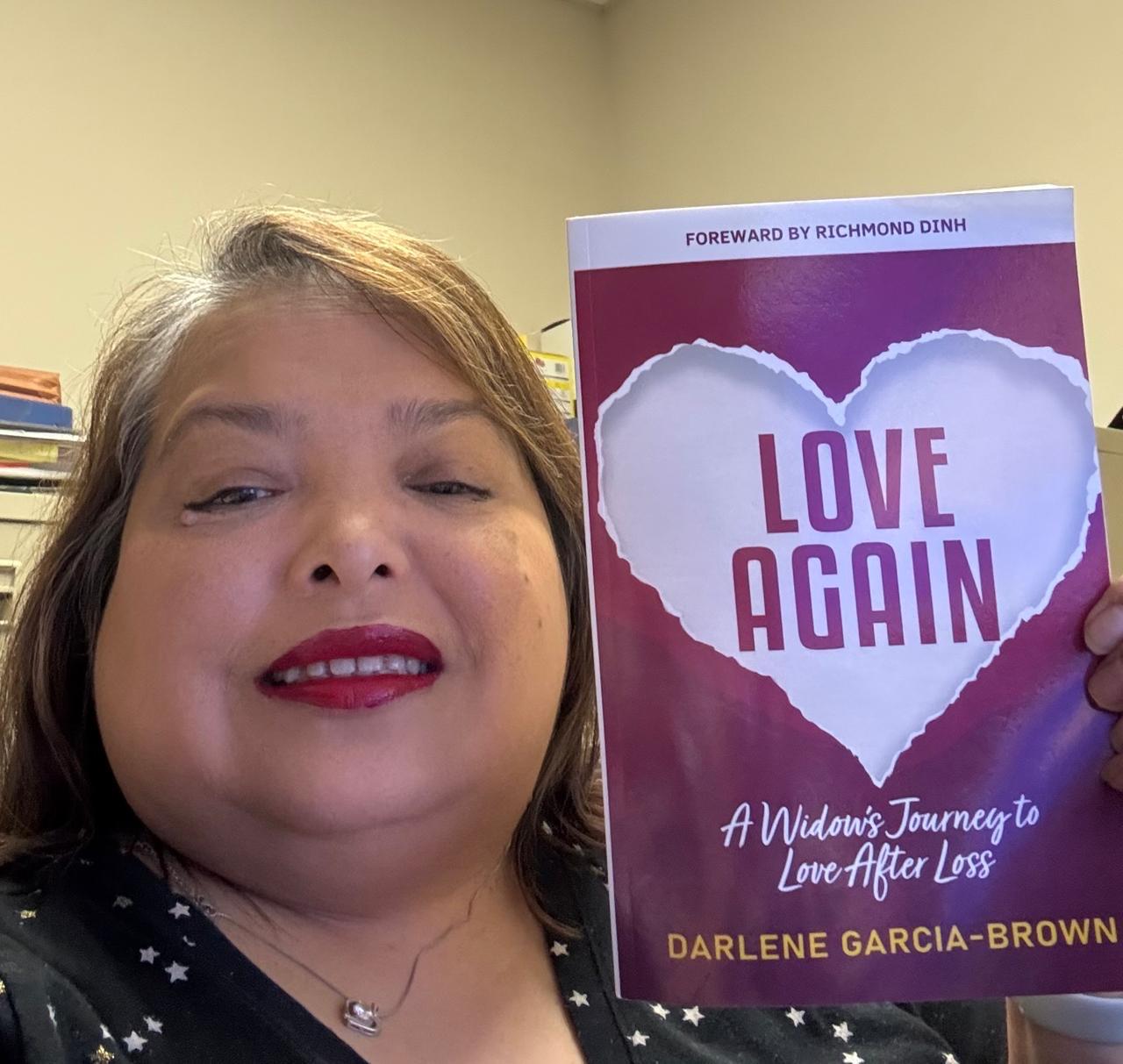 Widow holding Love Again book